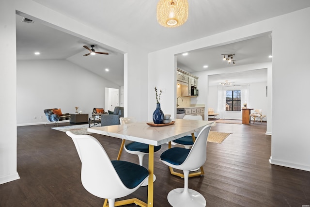 dining space featuring lofted ceiling, baseboards, visible vents, and dark wood-style flooring