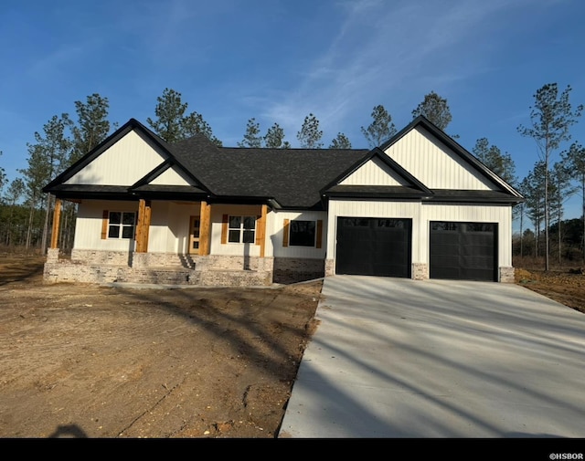 modern farmhouse style home with driveway, roof with shingles, and an attached garage