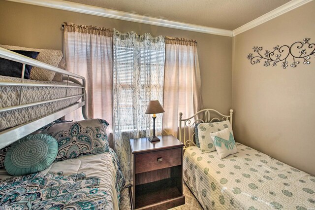 bedroom with crown molding