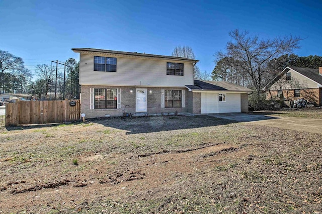 view of front of home with fence and brick siding