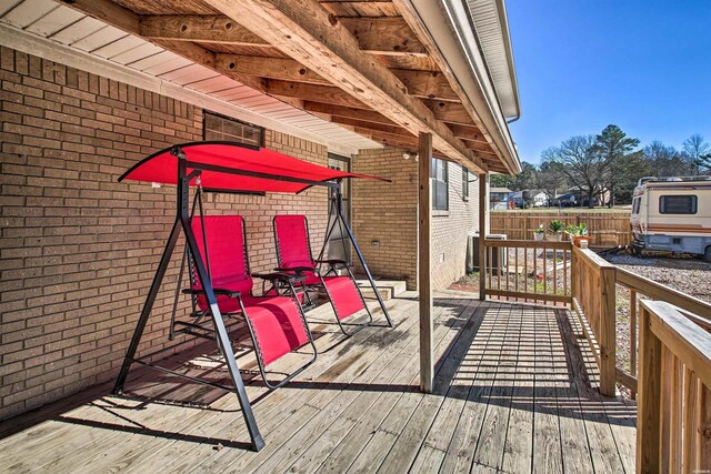 wooden deck featuring fence