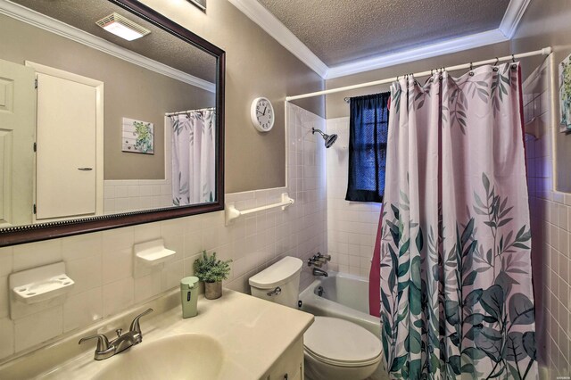 full bathroom featuring a textured ceiling, shower / bath combo, and crown molding