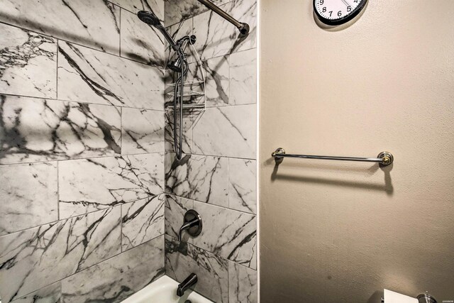 bathroom featuring washtub / shower combination