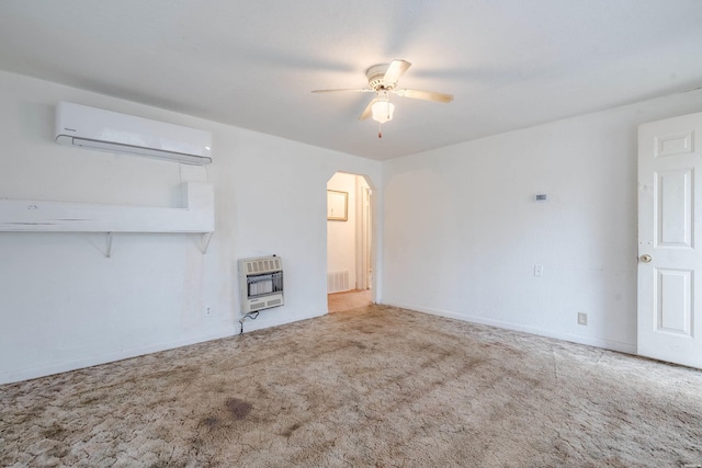 unfurnished living room featuring carpet floors, arched walkways, heating unit, an AC wall unit, and ceiling fan