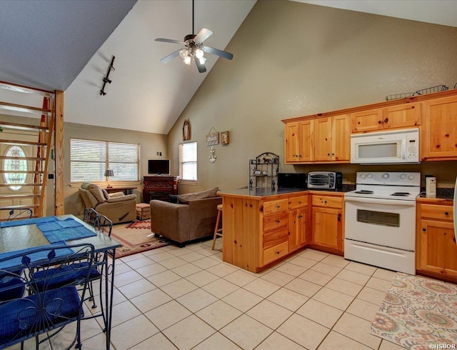 kitchen featuring light tile patterned floors, white appliances, open floor plan, brown cabinetry, and dark countertops