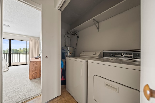 5371 Central Ave Unit 5K, Hot Springs, AR 71913 - laundry room with separate washer and dryer, light colored carpet, water heater, and a water view