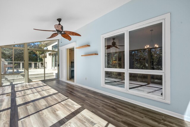 unfurnished sunroom featuring ceiling fan