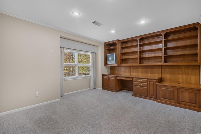 unfurnished office featuring built in desk, recessed lighting, visible vents, light carpet, and baseboards