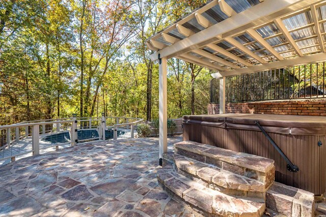 view of patio with a hot tub