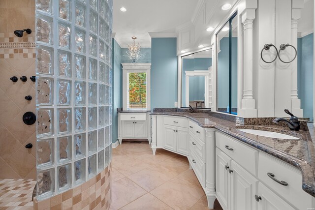 bathroom featuring a walk in shower, ornamental molding, tile patterned flooring, and vanity