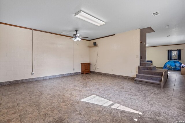 unfurnished room featuring ceiling fan, visible vents, baseboards, stairs, and ornamental molding