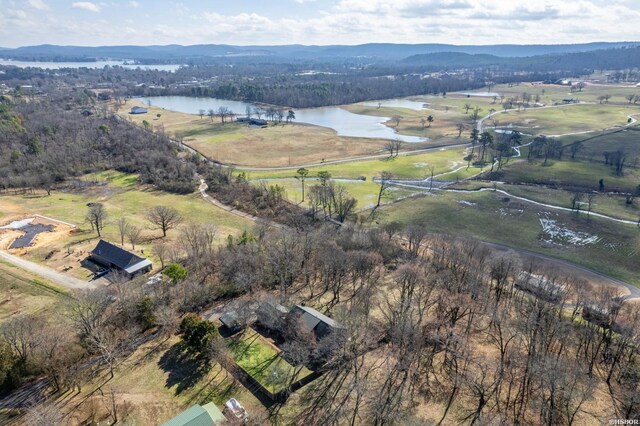 birds eye view of property featuring a water and mountain view