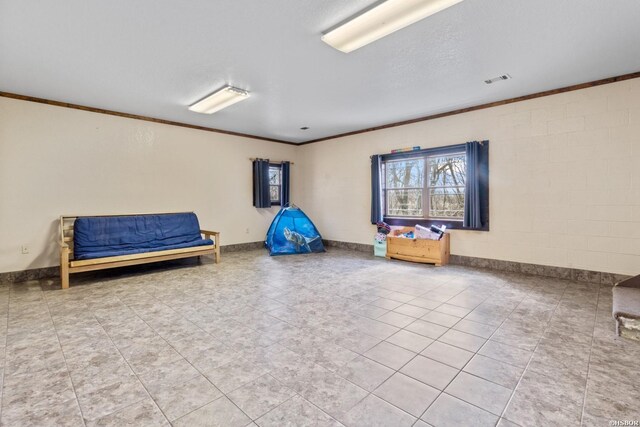 unfurnished room with visible vents, baseboards, and crown molding