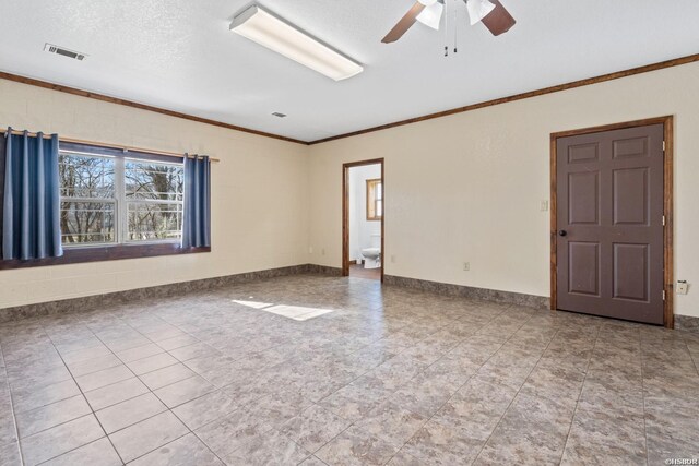 unfurnished room with crown molding, visible vents, a ceiling fan, a textured ceiling, and baseboards