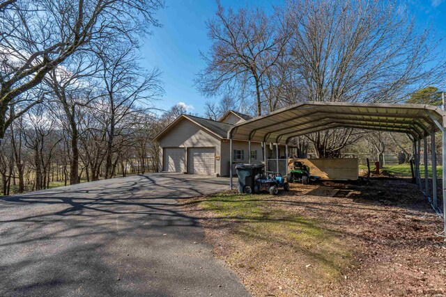 exterior space with aphalt driveway