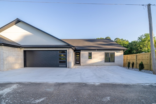 168 Krause Ln Unit A, Hot Springs, AR 71913 - view of front of home featuring an attached garage, brick siding, and driveway