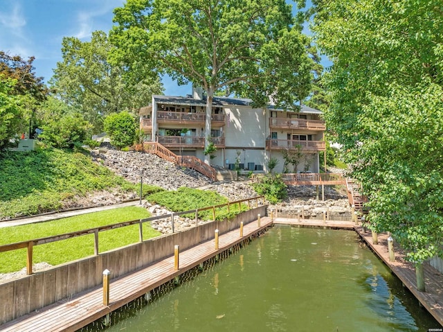 view of dock with a water view and stairs