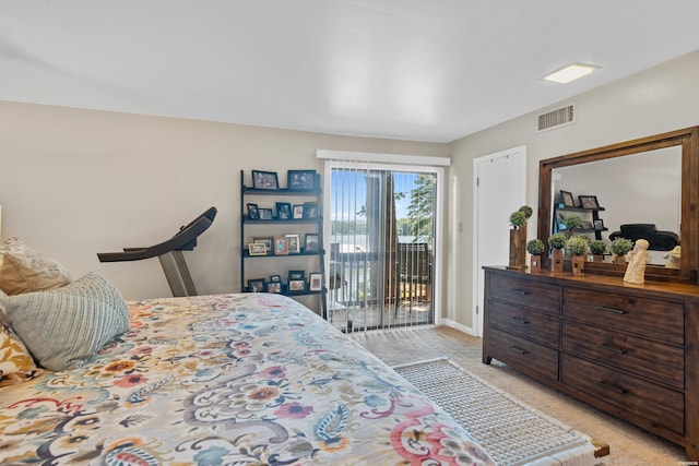 bedroom featuring light carpet, access to outside, visible vents, and baseboards