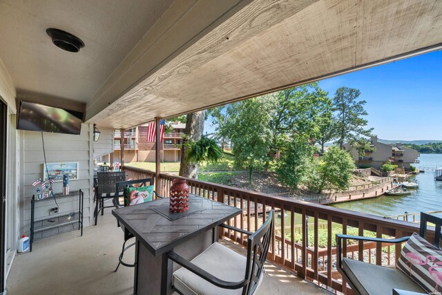 balcony featuring a water view