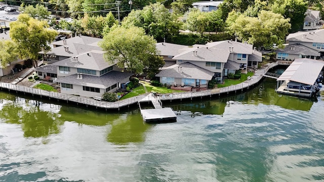 bird's eye view with a residential view and a water view