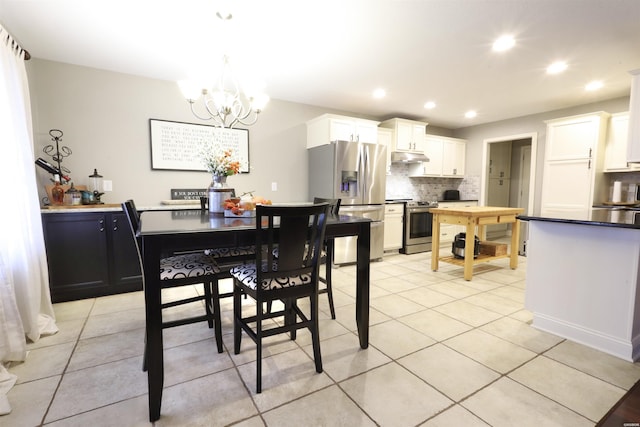 dining area with recessed lighting, a notable chandelier, and light tile patterned floors