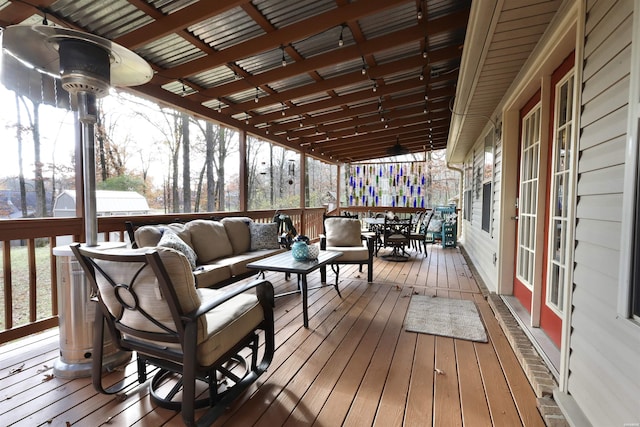 wooden deck featuring outdoor dining space