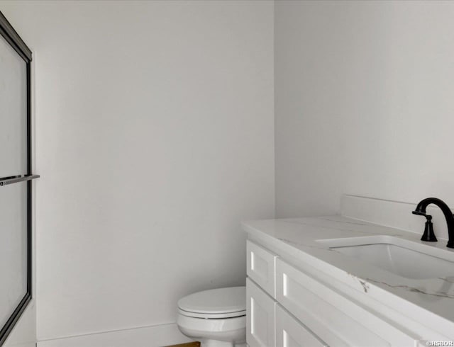 bathroom with toilet and vanity