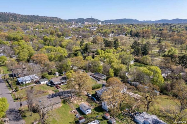 drone / aerial view with a mountain view and a wooded view