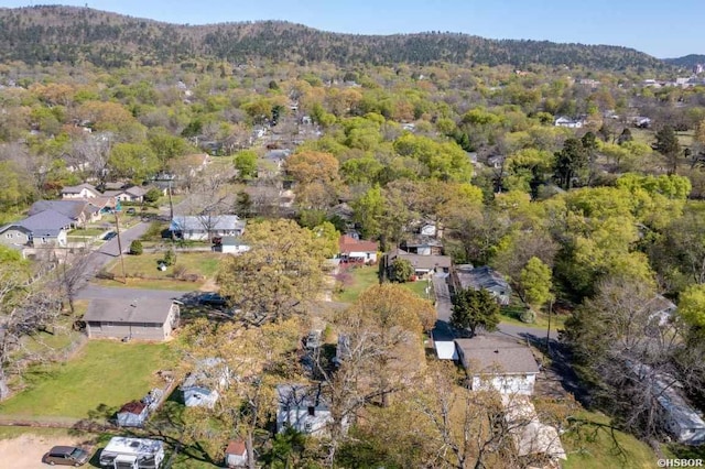 aerial view featuring a forest view and a mountain view