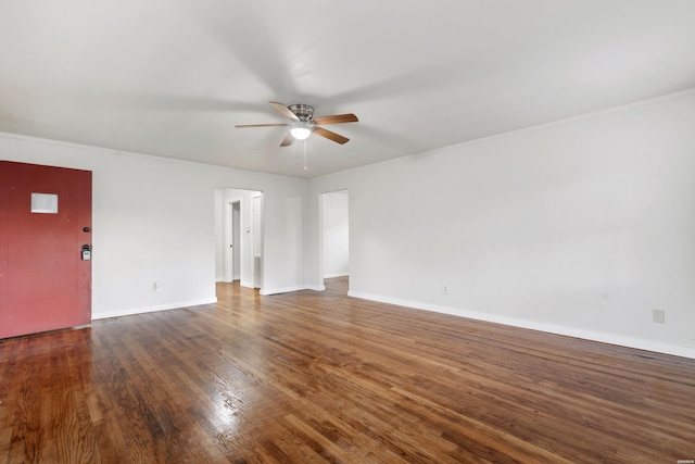 unfurnished room featuring a ceiling fan, baseboards, and wood finished floors