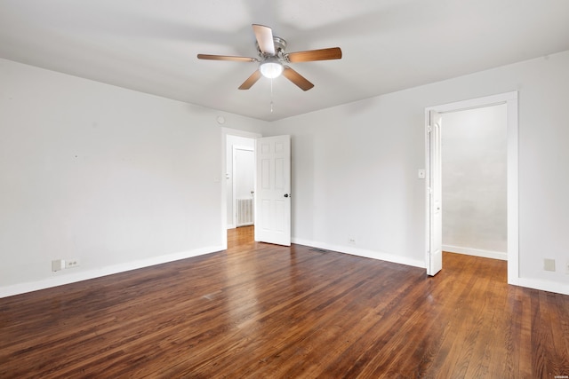 unfurnished room with visible vents, ceiling fan, baseboards, and wood finished floors