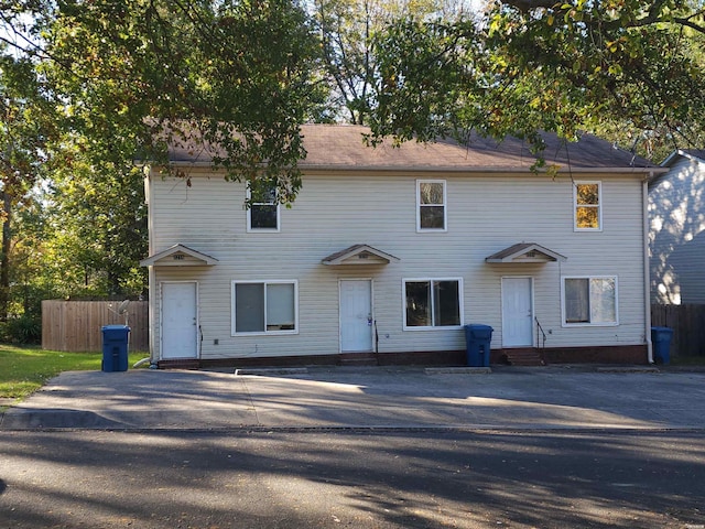 view of front of house with entry steps and fence