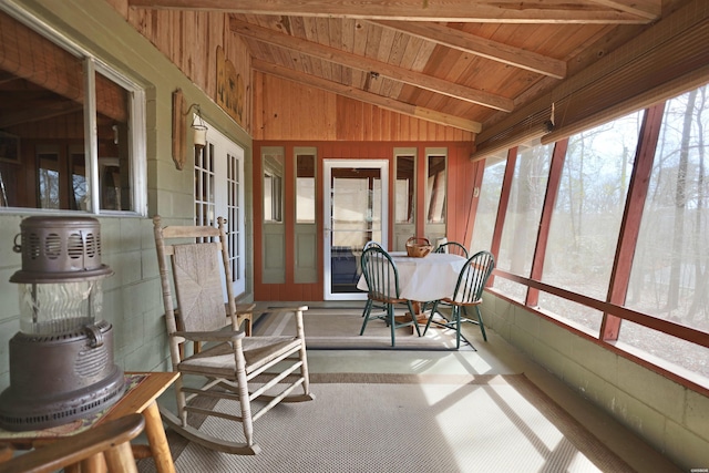 sunroom with wood ceiling and vaulted ceiling with beams