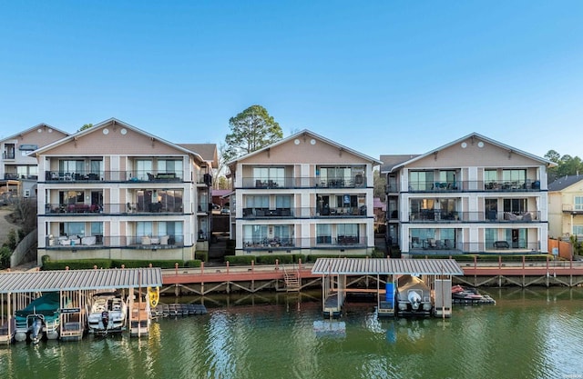 back of house featuring a water view