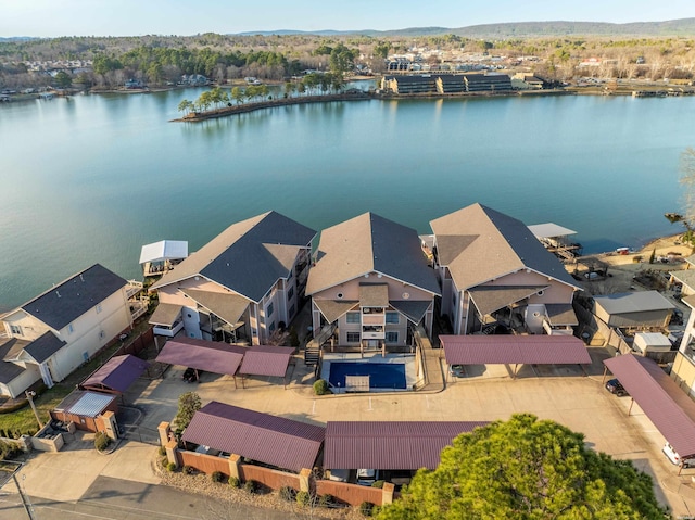 birds eye view of property featuring a residential view and a water view