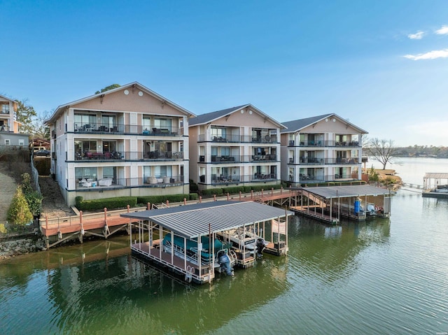 dock area featuring a water view and boat lift