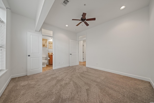 unfurnished bedroom with light carpet, baseboards, visible vents, beam ceiling, and recessed lighting