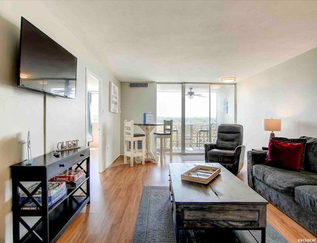 740 Weston Rd Unit A-706, Hot Springs, AR 71913 - living area featuring a wall of windows, light wood-style floors, and ceiling fan