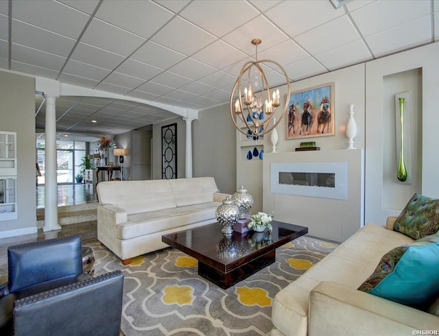 740 Weston Rd Unit A-706, Hot Springs, AR 71913 - living room featuring ornate columns, a drop ceiling, and a chandelier