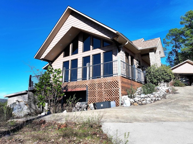 view of front of home featuring roof with shingles