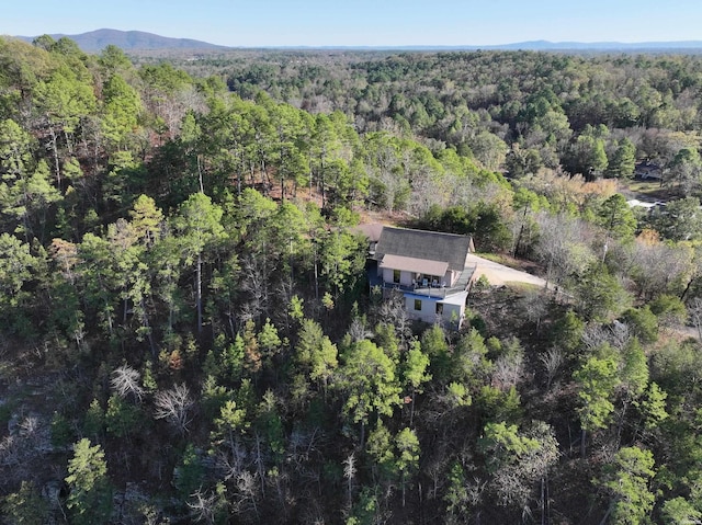 bird's eye view featuring a forest view and a mountain view