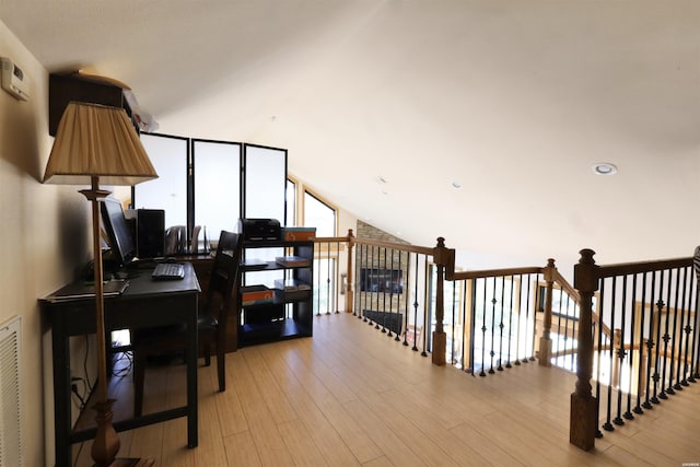 interior space with light wood finished floors and floor to ceiling windows