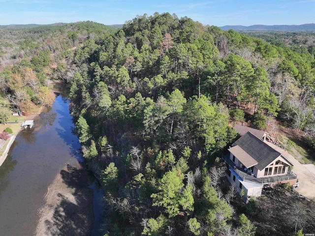 birds eye view of property with a forest view