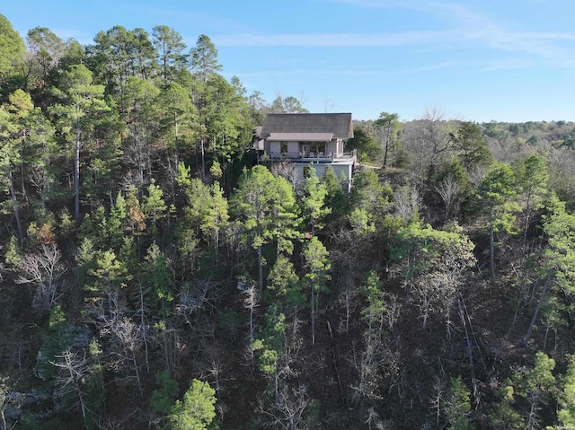 drone / aerial view featuring a forest view