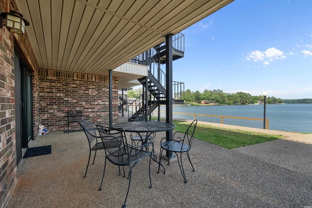 5371 Central Ave Unit 6D, Hot Springs, AR 71913 - view of patio / terrace with stairs, a water view, and outdoor dining space