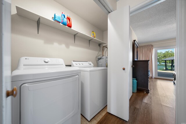 5371 Central Ave Unit 6D, Hot Springs, AR 71913 - washroom featuring wood finished floors, washer and clothes dryer, and water heater