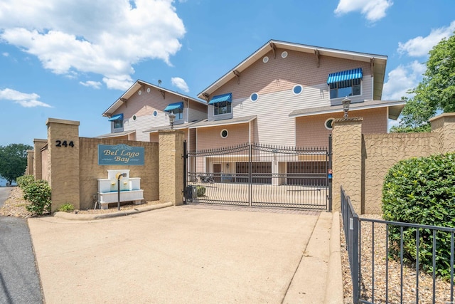 244 Bayou Pt Unit 401-B, Hot Springs, AR 71913 - view of front of house featuring driveway, a gate, and fence
