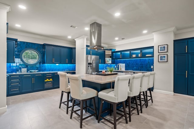 244 Bayou Pt Unit 401-B, Hot Springs, AR 71913 - kitchen featuring stainless steel refrigerator with ice dispenser, island range hood, decorative backsplash, blue cabinets, and ornamental molding