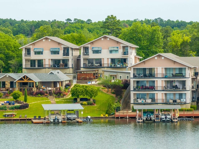 244 Bayou Pt Unit 401-B, Hot Springs, AR 71913 - back of property with boat lift, a water view, and a wooded view