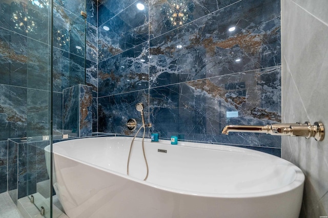 244 Bayou Pt Unit 401-B, Hot Springs, AR 71913 - bathroom with tile walls and a freestanding tub